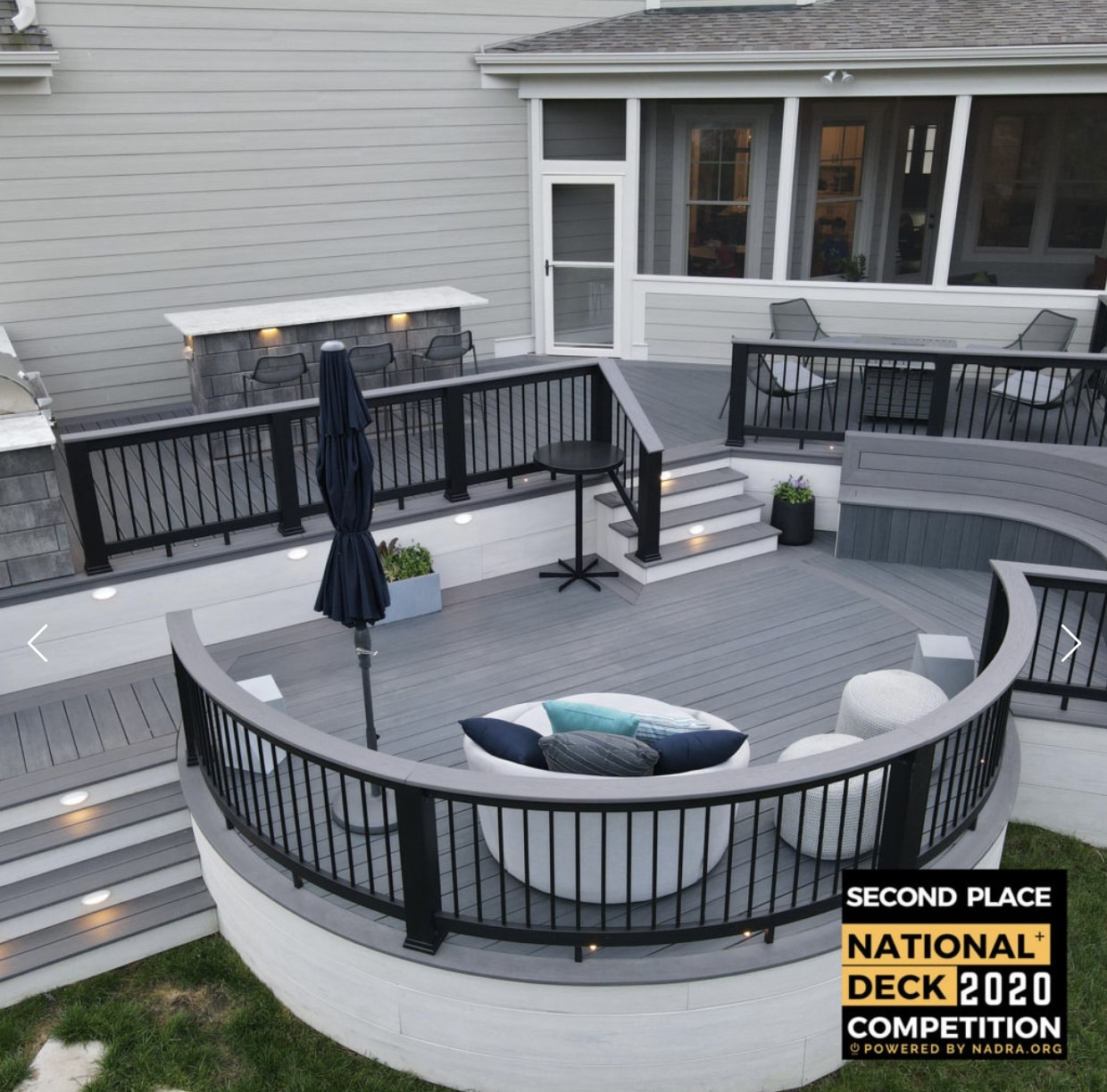Photo of an award-winning multi-level, curved deck.