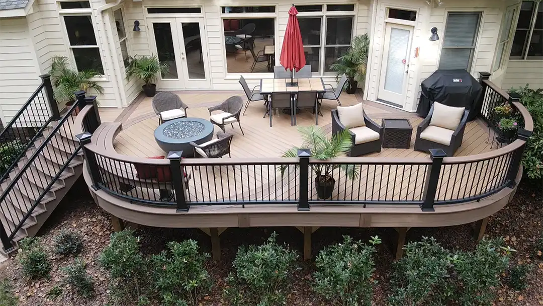 photo of raised deck with outdoor furniture - Custom Curved Deck builder and contractor - Raleigh, North Carolina