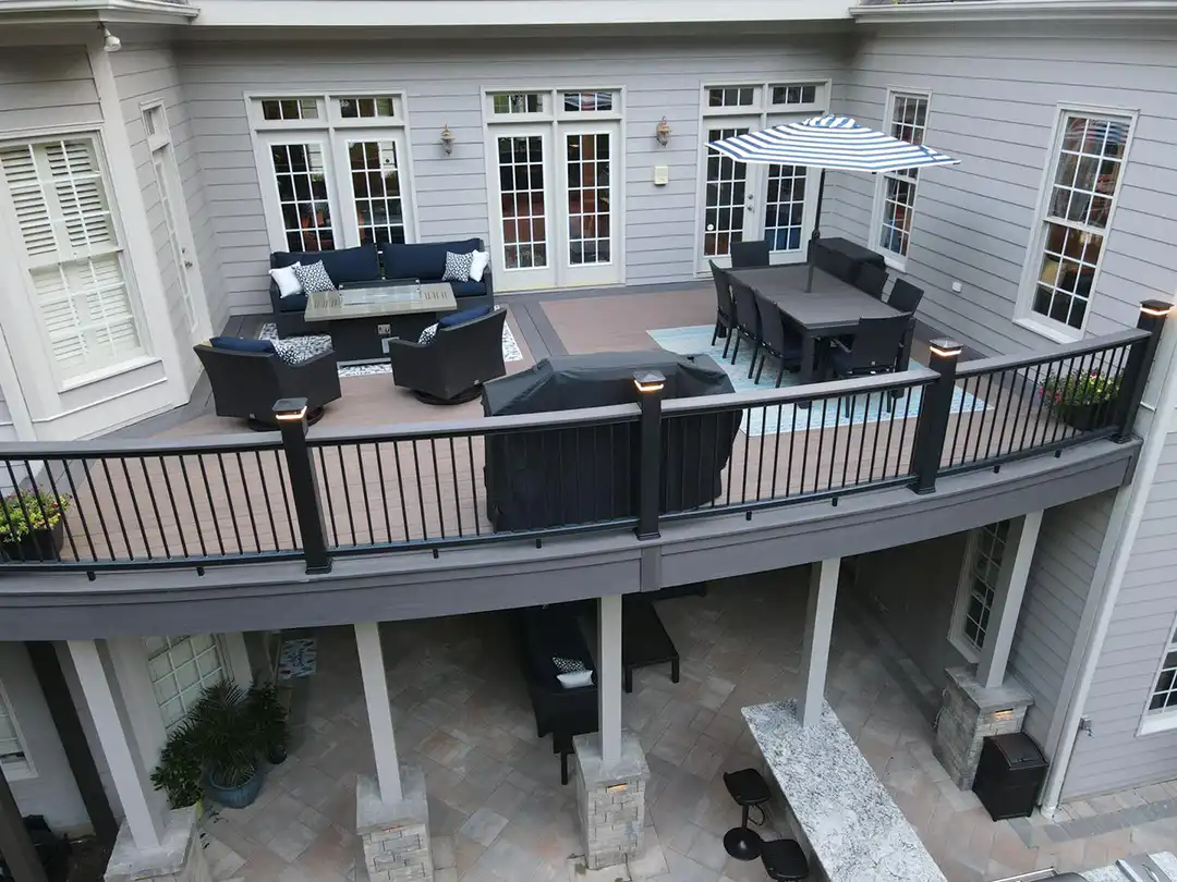 Photo of elevated deck made of TimberTech decking with outdoor furniture - Custom TimberTech Deck builder and contractor - Raleigh, North Carolina