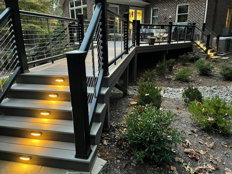 composite deck with walkway and steps with in-step lighting.