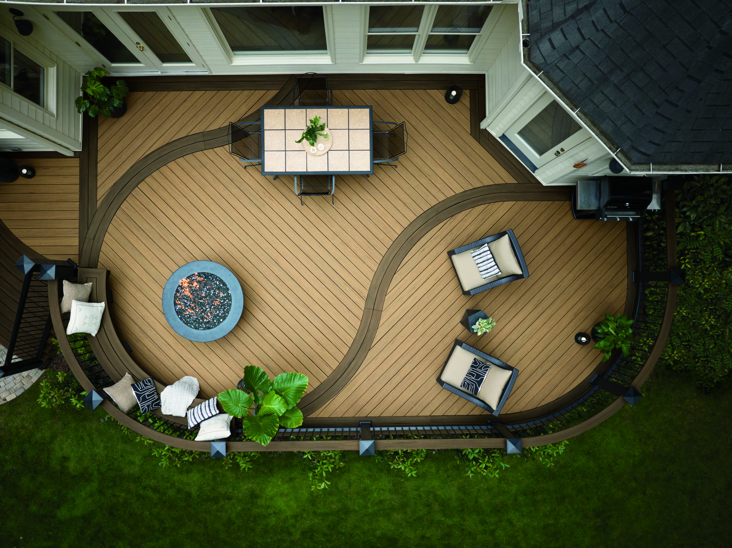 TimberTech deck with a fire pit and outdoor furniture - Cool composite decking