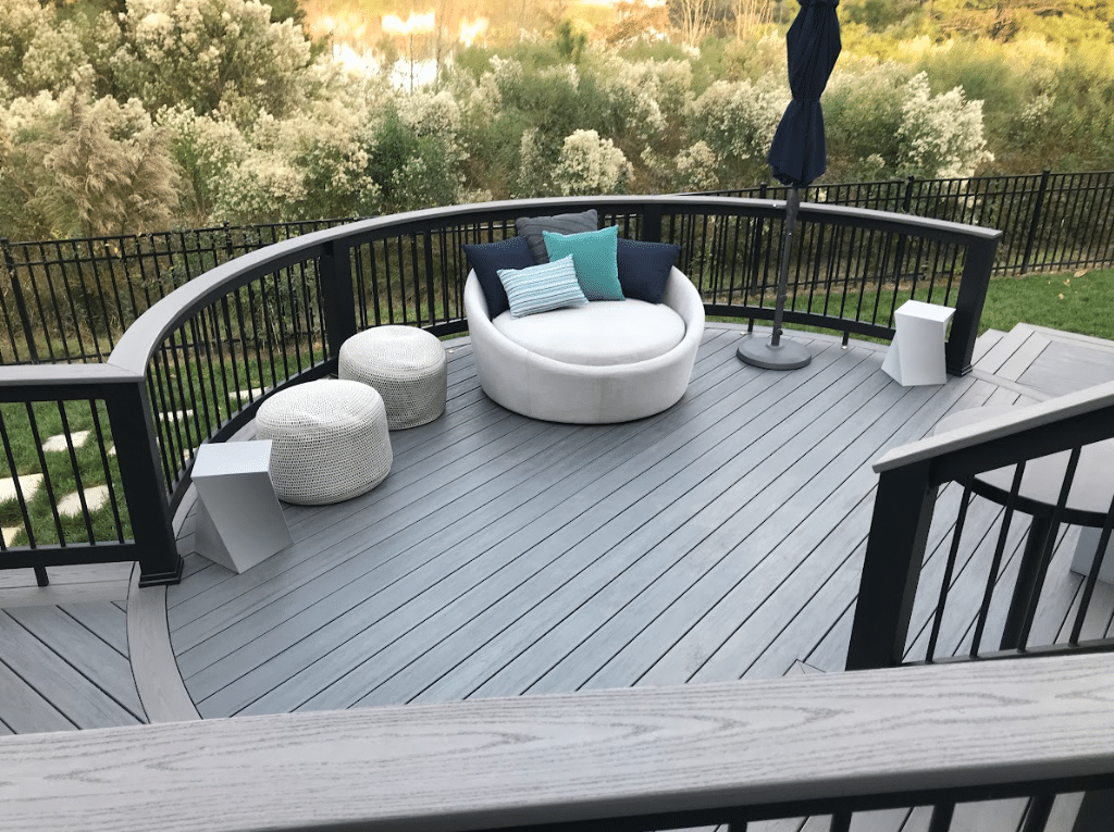 curved deck design with outdoor furniture