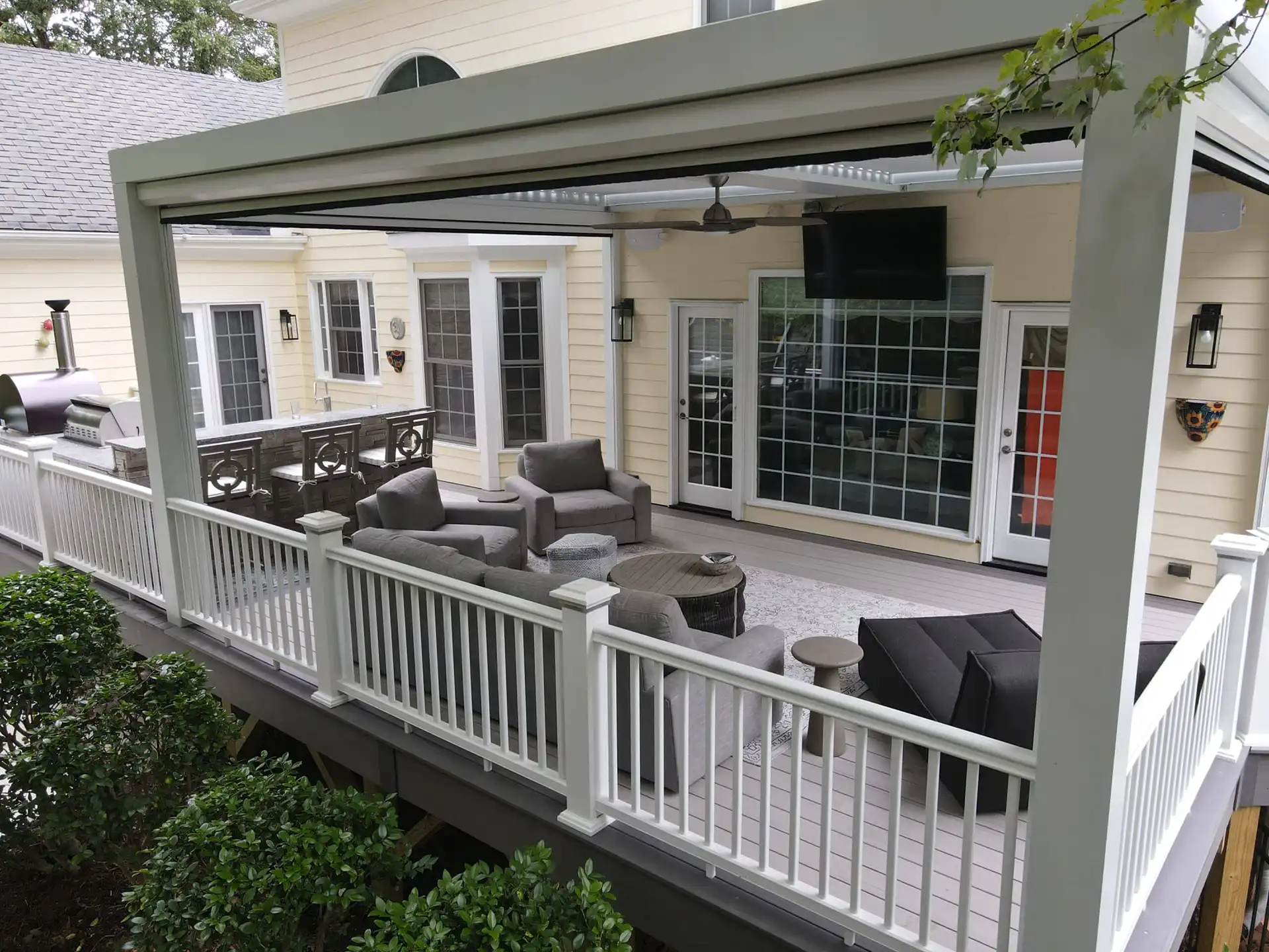 photo of composite deck with pergola and outdoor furniture - Composite covered pergolas