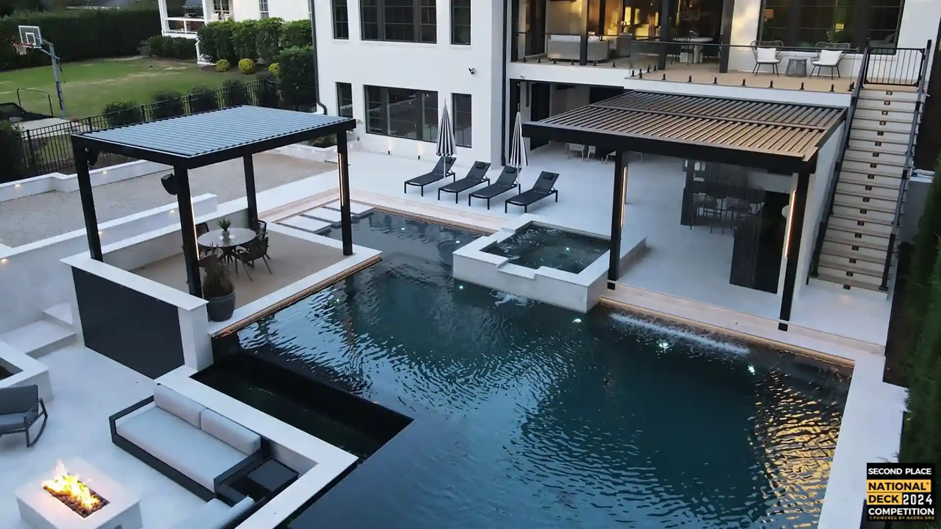 photo of elaborate pool deck with multiple pergolas and outdoor furniture