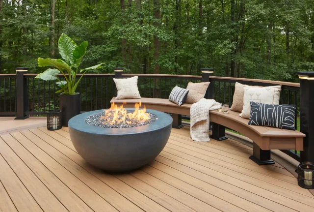 photo of a timbertech composite deck with outdoor furniture and fire feature