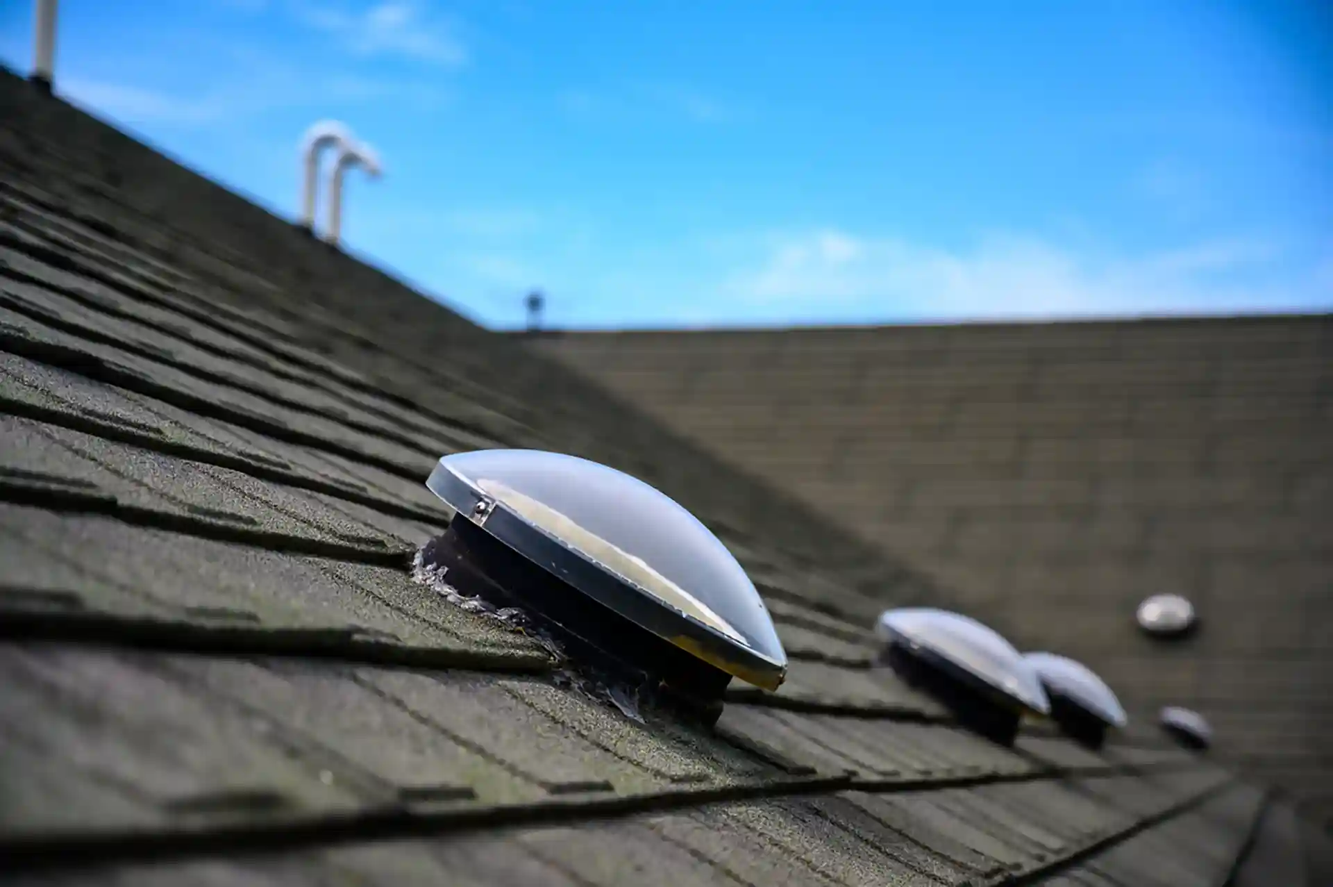 Photo of solar tubes, also known as solar tunnels, installed int a roof.