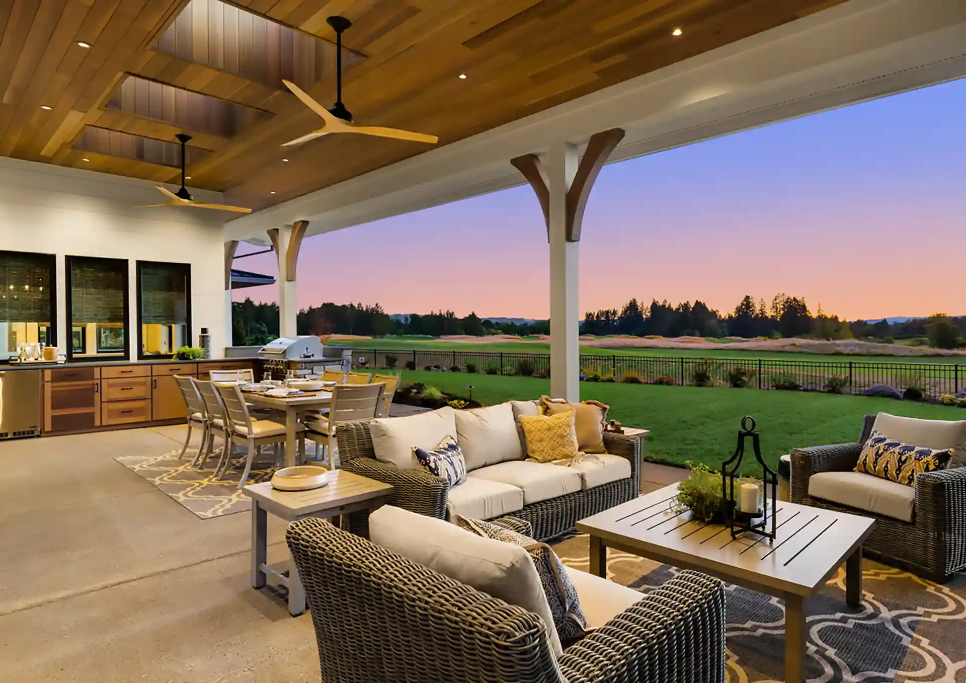 Photo of a covered patio with skylights, outdoor living room, outdoor dining room, and outdoor kitchen