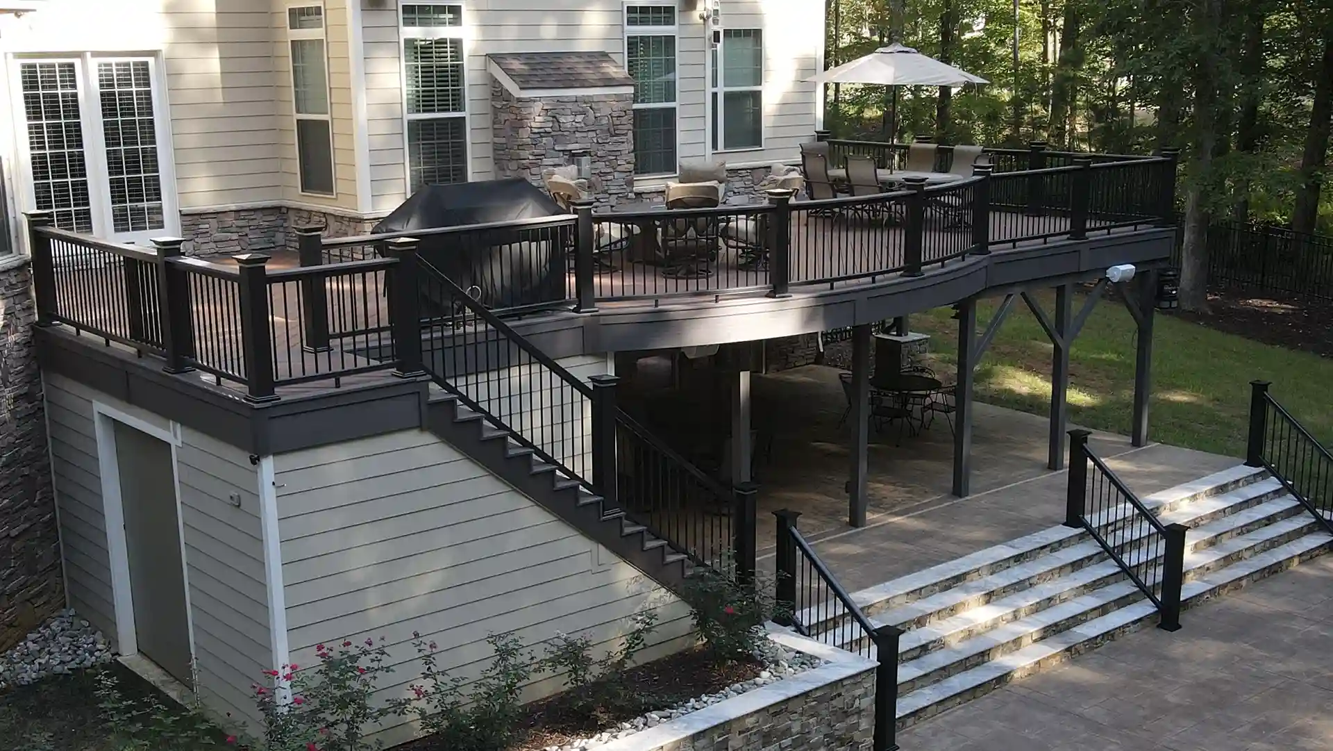 Photo of an elevated deck with patio below.