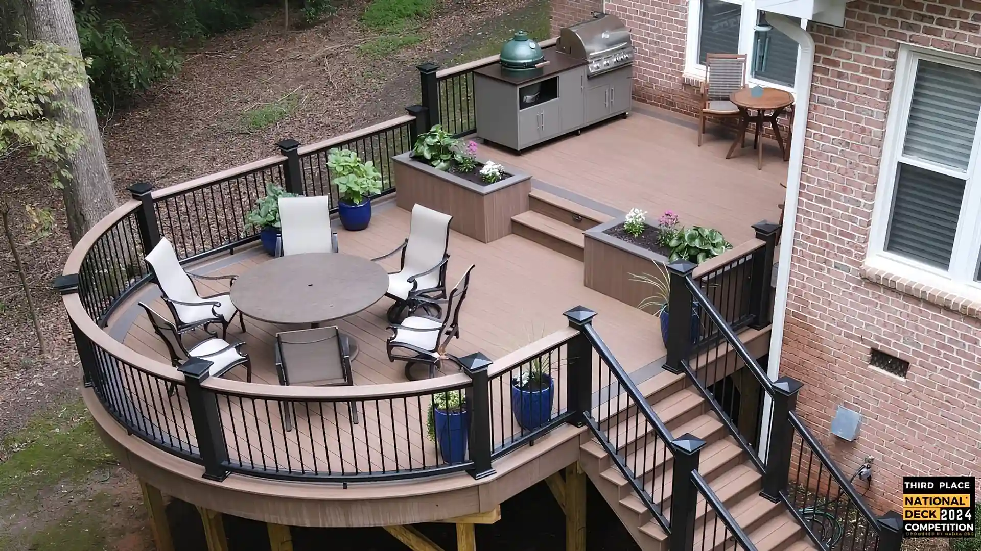 Photo of a multi-level deck with an outdoor kitchen/grilling station by Majestic Outdoors, a company that builds a deck and outdoor kitchen in Wake Forest and the Greater Raleigh, NC, area.